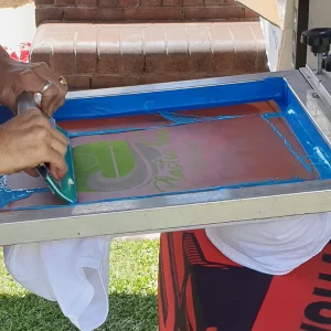 person-using-squeegee-for-screen-printing-2023-11-27-05-20-39-utc
